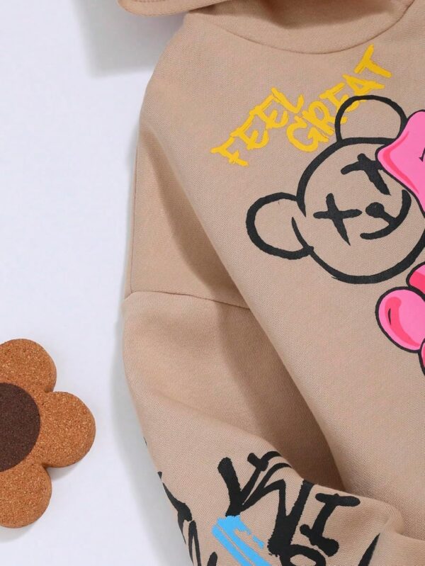WDIRARA Girl’s Cartoon Letter Graphic Hoodie Drop Shoulder Long Sleeve Pullover Sweatshirt